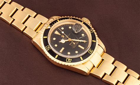 rolex submariner gold watch.